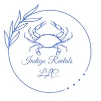 A blue and white logo of an ocean themed business.