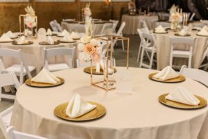 A dining table with plates and napkins