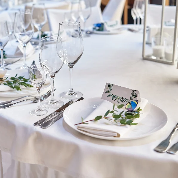 A table set with plates and silverware on it.